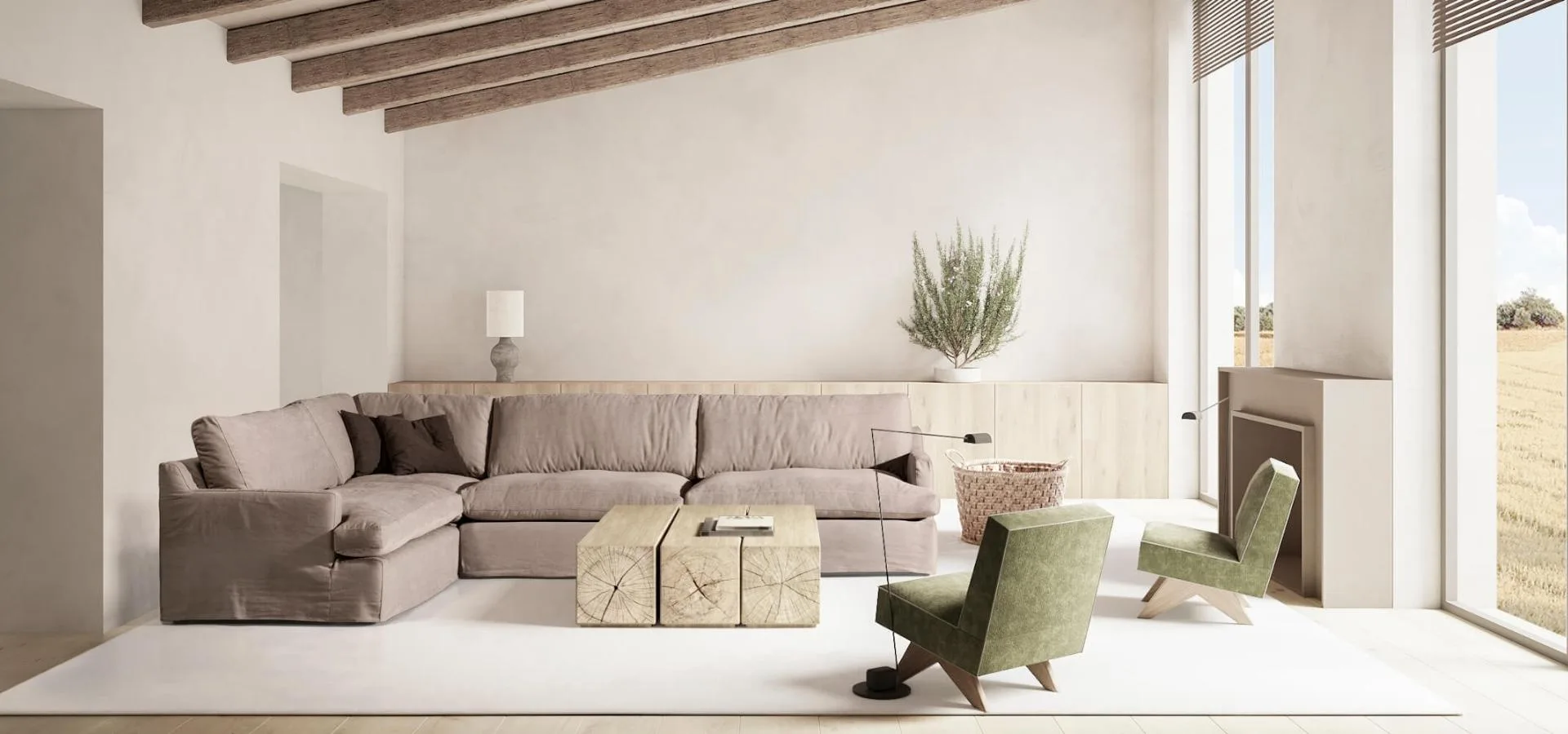 Sofá Upi rinconera en gris topo en un salón con vigas de madera, dos butacas verdes y mesas bajas de madera